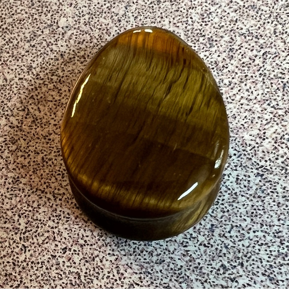 Double flare teardrop shaped Tiger’s Eye stone plug for stretched earlobe.